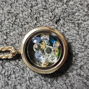 Elegant Goldtone Pendant Necklace with Charms